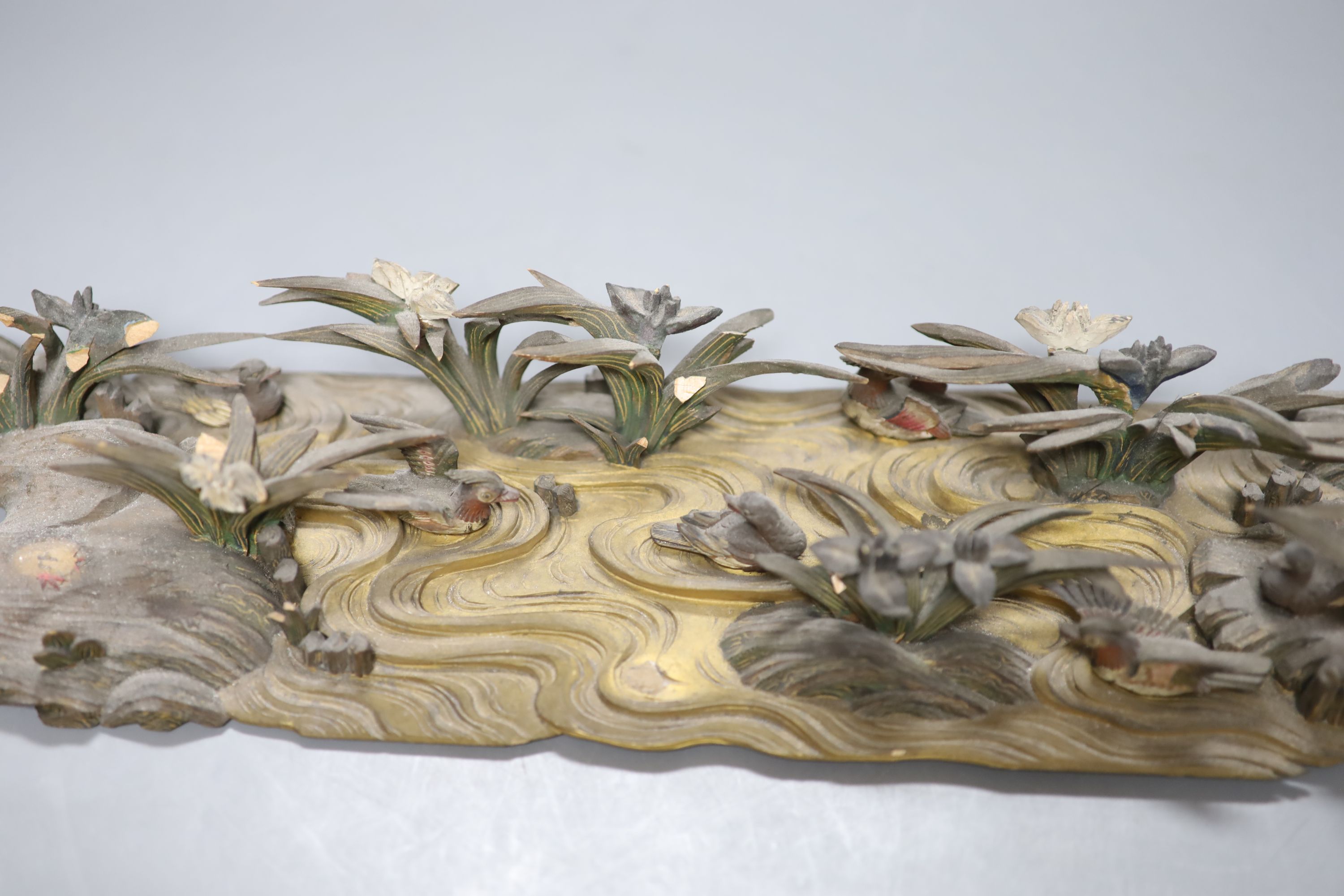 A Japanese carved and painted wood model of ducks on a pond, Meiji period, 40cm